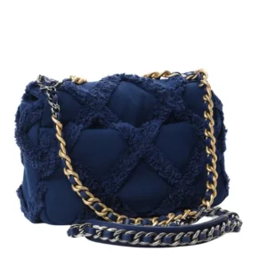 Chanel 19 Flap Bag in rich navy blue, with gold and silver chain embellishments.
