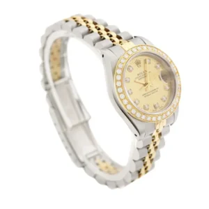 Stunning Rolex Datejust Oyster Perpetual ladies timepiece crafted in 18k yellow gold with diamond embellishments.