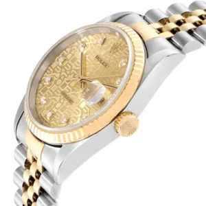 A stunning Datejust Rolex 26mm watch with a two-tone yellow gold dial. A perfect blend of elegance and style.