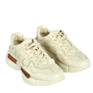 Gucci beige sneakers with the word "Gucci" on the side. Stylish footwear priced at $320.