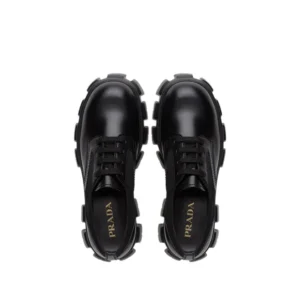 Prada lace up shoes in black leather with platform sole, priced at $300