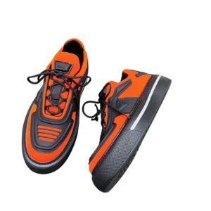 Stylish orange Prada sneakers priced at $300. Features re-nylon and brushed leather
