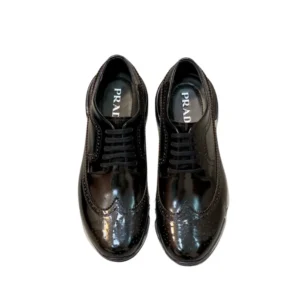 Prada Derby Shoes: Black leather shoes with a shiny sole, perfect for a stylish and sophisticated look