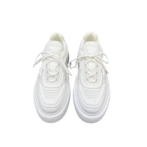 Stylish white Prada Monolith sneakers with laces, crafted from re-nylon material and showcasing a lug-sole
