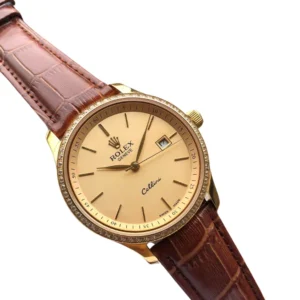 An exquisite and sophisticated gold Rolex Cellini watch with a brown leather band.