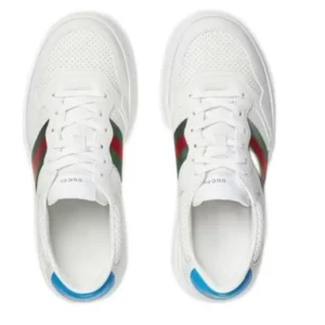 Fashion-forward Gucci Embossed Low Top sneakers with eye-catching red, and green stripes, a must-have for sneaker enthusiasts.