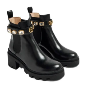 Stylish Black Gucci Leather Ankle Boots with elegant gold detailing, perfect for adding a touch of glamour to any outfit.
