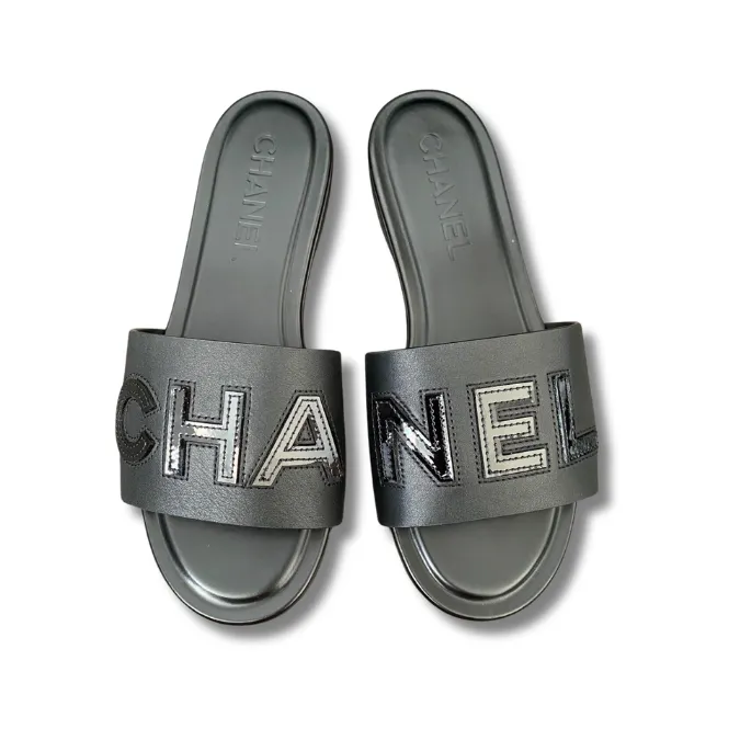 Stylish Chanel logo Black slides, perfect for a casual yet chic look.