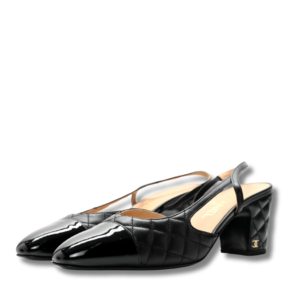 A stylish pair of black Cap Toe Slingback Pumps by Chanel, perfect for adding a touch of elegance to any outfit.