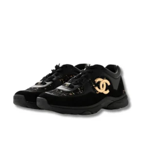 Chanel Velour Tweed sneakers featuring a striking gold and black logo, ideal for those who appreciate high-end fashion.