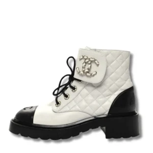Stylish Chanel Combat Ankle Boots with edgy chain detailing, perfect for adding a touch of attitude to any outfit.