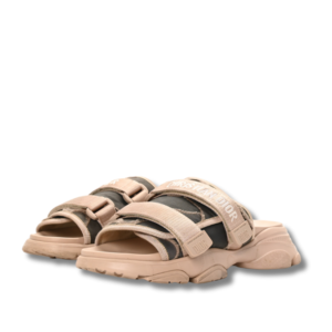 Dior D-wander Beige slides with side straps, perfect for a casual day out.