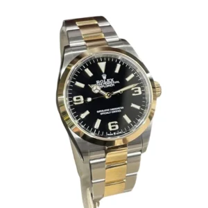 A sleek Rolex Explorer Two Tone watch with a black dial and steel bracelet, perfect for any stylish adventurer.
