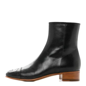 A sleek Black Leather Ankle Boots, perfect for any occasion. Its stylish design and high-quality material make it a must-have accessory.