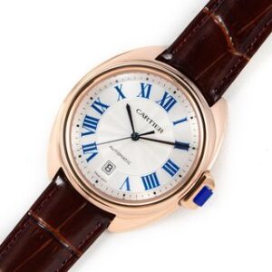 Sleek watch with white dial & Rose Gold bezel features elegant Roman numerals. It's Cle de Cartier 31mm, Maroon Strap watch.