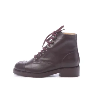 Step out in confidence with these Chanel leather Velvet short boots, featuring laces for a secure and fashionable fit.