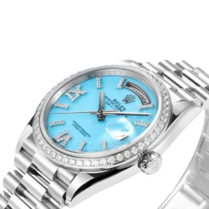 Behold the exquisite Rolex Day-Date 36mm watch featuring a captivating blue dial, diamond bezel, and a sturdy steel bracelet.