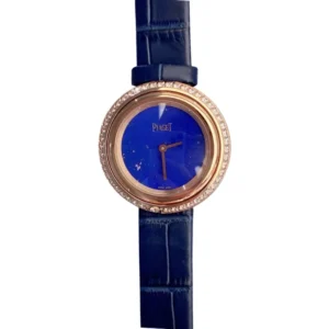 Piaget Blue Dial watch adorned with gold bezel and shimmering diamonds.