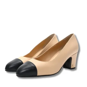 Fashionable leather Cap-Toe Pumps with a block heel in beige and black.