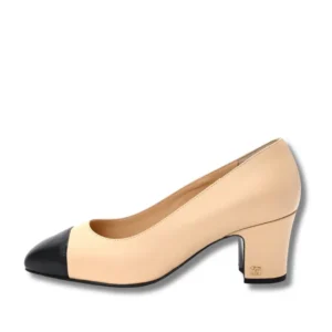 Fashionable leather Cap-Toe Pumps with a block heel in beige and black.