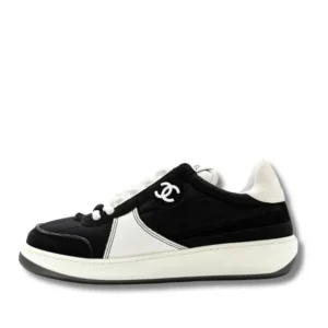 Black and white Cruise Chanel Platform sneakers, the epitome of luxury and style.