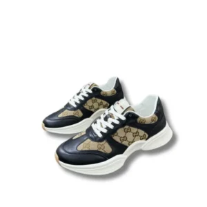 Gucci GG Canvas Sneakers showcasing a sleek brown and black monogram pattern, a must-have for any sneaker enthusiast.