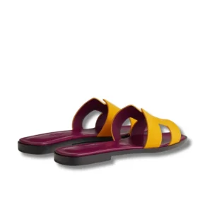 Step into summer with these vibrant Hermes Oran Slides featuring a famous H logo design.
