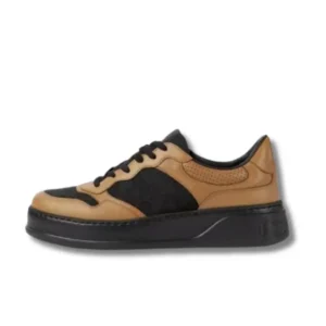 A stylish pair of Chanel Panelled Lace Up Shoes in brown and black, perfect for any casual outfit.