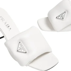 Get these stunning Prada Logo Plaque Women's mules, adorned with a fashionable triangle detail on a padded front.