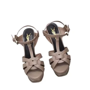 Simple yet fashionable YSL Tribute Platform nude sandals adorned with dainty straps.