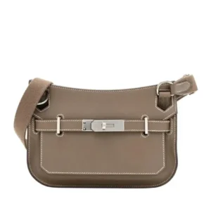 A stylish Hermes Mini Jypsiere Leather Cross-body bag with a chic buckle. Perfect for hands-free convenience.