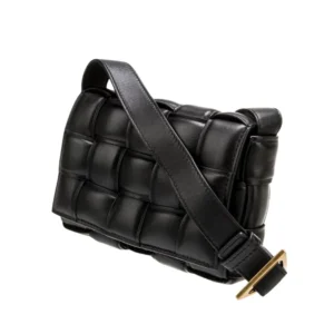A stylish Black Leather Cross-body Cassette Padded bag made from intricately woven material. Perfect for any occasion!