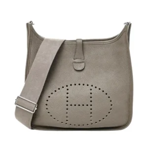 Get noticed with this Hermes perforated Evelyne III PM leather bag, a must-have accessory.