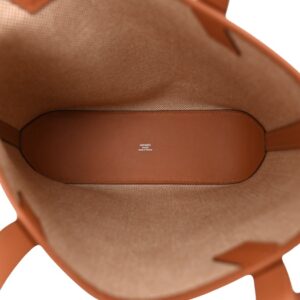 Hermes Cabas Bag: Beige and Cream tote bag featuring a sleek brown strap.